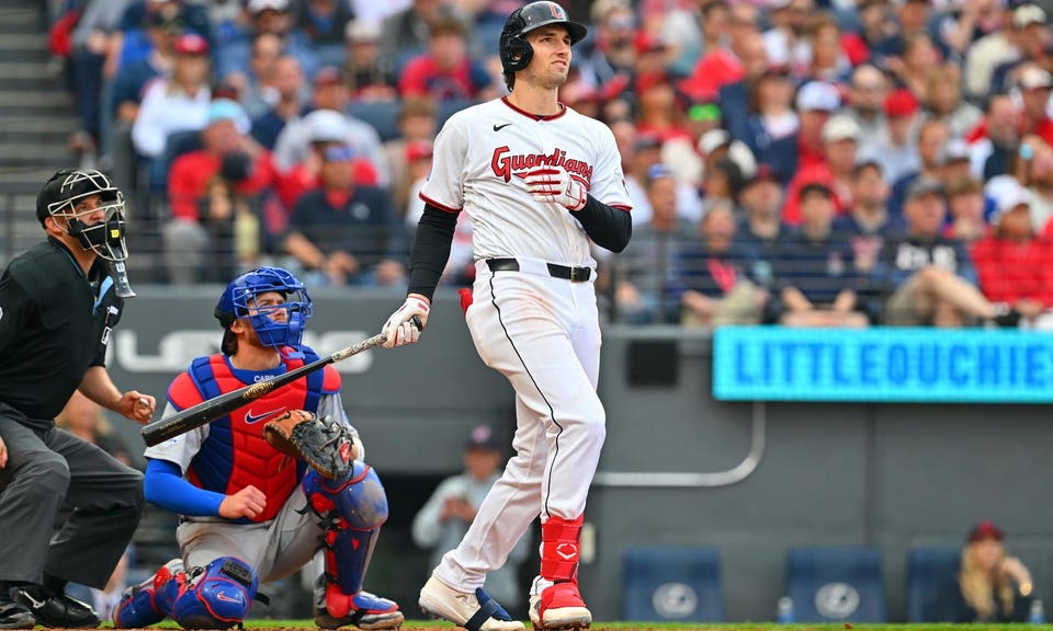 Chase DeLauter watches a home run.