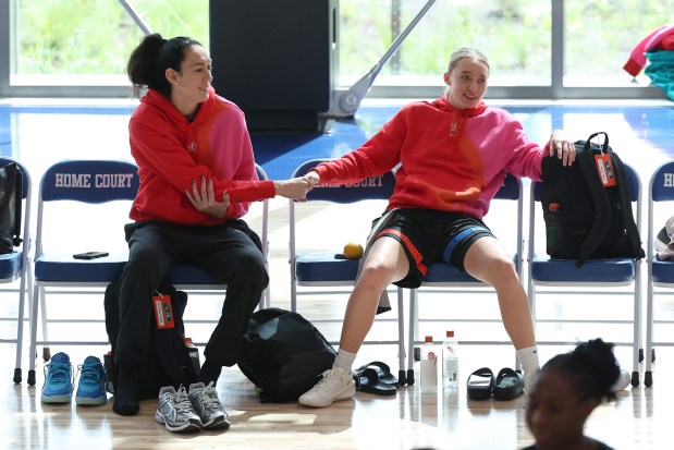 Breanna Stewart, left, of the New York Liberty slaps hands with Paige Bueckers of the Dallas Wings during a practice session for the WNBA All-Star game in Chicago (Getty)