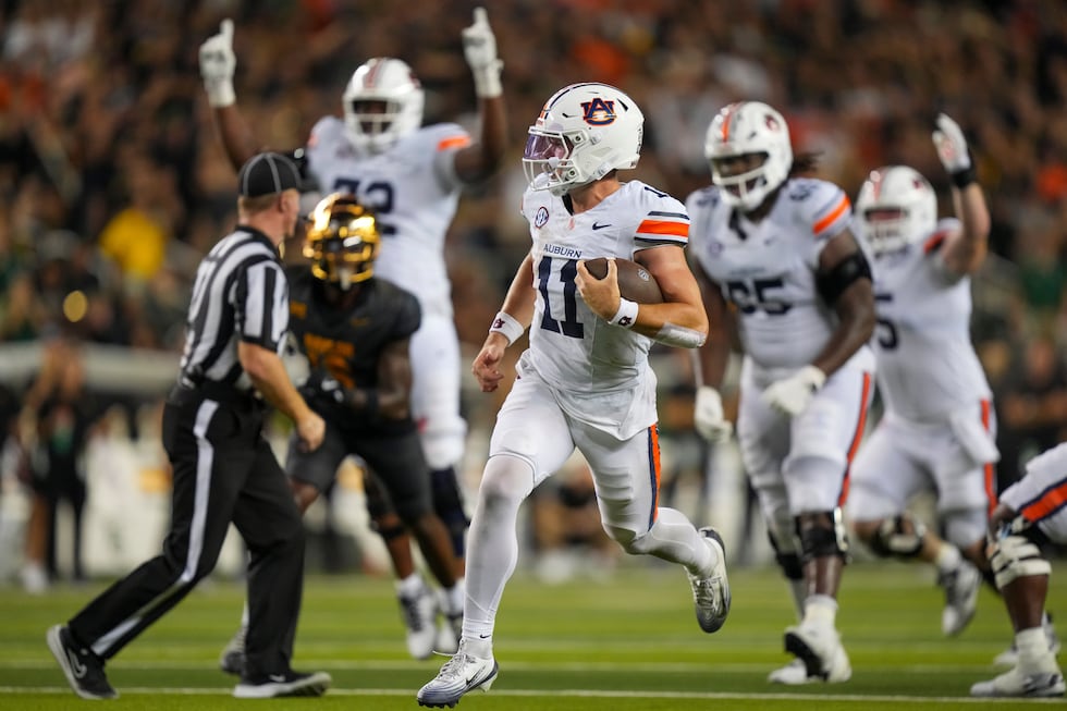 FILE - Auburn quarterback Jackson Arnold (11) runs for a touchdown against Baylor during the...