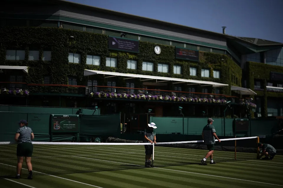 Groundstaff prepare the courts at The All England Lawn Tennis and Croquet Club in Wimbledon during the heatwave conditions (AFP/Getty)