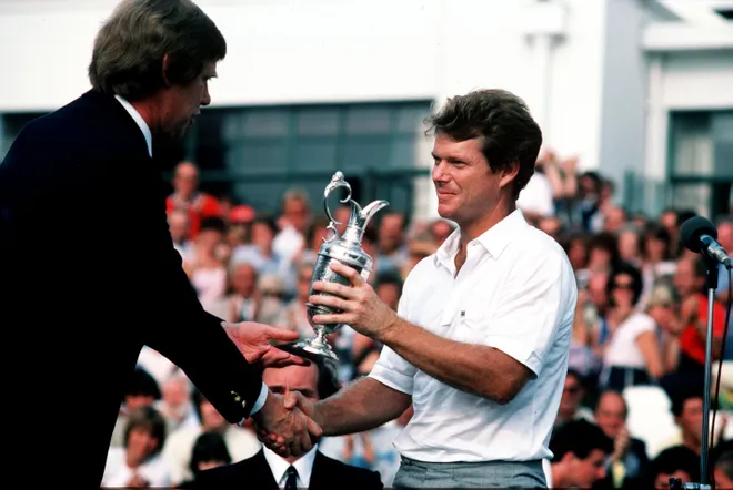 Tom Watson receives the Claret Jug following his victory at the 1983 Open at Royal Birkdale.