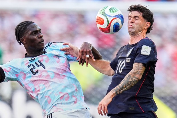 Belgium's Amadou Onana, left, and United States' Christian Pulisic battle for the ball during the World Cup round of 16 soccer match in Seattle, Monday, July 6, 2026. (AP Photo/Manu Fernandez)