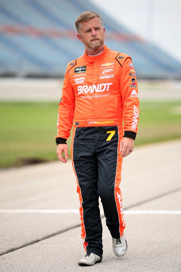 Justin Allgaier, driver of the No. 7 BRANDT Professional Agriculture Chevrolet, walks the grid during practice for the NASCAR O'Reilly Auto Parts Series Cuervo 300 at Chicagoland Speedway on July 4, 2026, in Joliet. (James Gilbert/Getty)