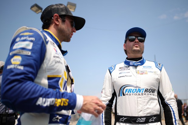 Noah Gragson, right, driver of the No. 4 Long John Silver's Ford, and Chase Elliott, driver of the No. 9 NAPA Auto Parts Chevrolet, talk on the grid during qualifying for the NASCAR Cup Series eero 400 at Chicagoland Speedway on July 4, 2026, in Joliet. (Jonathan Bachman/Getty)