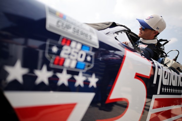 Kyle Larson, driver of the No. 5 HendrickCars.com Chevrolet, enters his car during qualifying for the NASCAR Cup Series eero 400 at Chicagoland Speedway on July 4, 2026, in Joliet. (Jonathan Bachman/Getty)