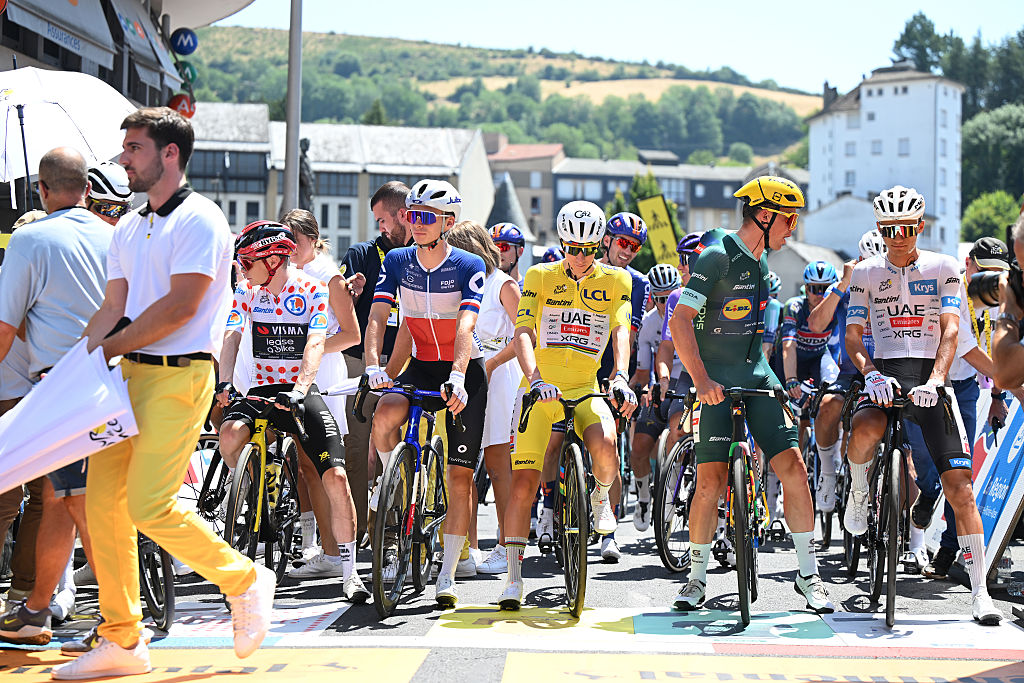 Stage 10 start in Aurillac saw front row with (L-R) Jonas Vingegaard in the Polka dot Mountain Jersey, Tadej Pogacar in the Yellow Leader Jersey, Mads Pedersen in the Green Sprint Jersey and Isaac Del Toro in the White best Young Rider Jersey