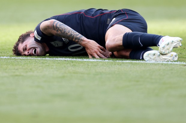 Christian Pulisic #10 of the United States reacts after being challenged by Youri Tielemans #8 of Belgium during the FIFA World Cup 2026 Round of 16 match between USA and Belgium at Seattle Stadium on July 06, 2026 in Seattle, Washington. (Photo by Carl Recine/Getty Images)