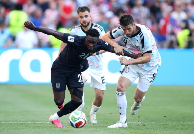 Folarin Balogun #20 of the United States competes for the ball against Brandon Mechele #4 of Belgium during the FIFA World Cup 2026 Round of 16 match between USA and Belgium at Seattle Stadium on July 06, 2026 in Seattle, Washington. (Photo by Alex Grimm/Getty Images)