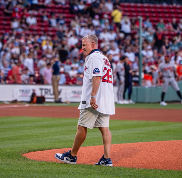 New UConn football coach Jason Candle, a life-long Red Sox fan, delivered the first pitch at Fenway Park last Tuesday before the 14th of the Red Sox's 15 wins in a row. (UConn Football/Instagram)