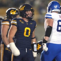 Nov 29, 2025; Berkeley, California, USA; California Golden Bears linebacker Cade Uluave (0) reacts after a tackle during the second quarter against the Southern Methodist Mustangs at California Memorial Stadium.