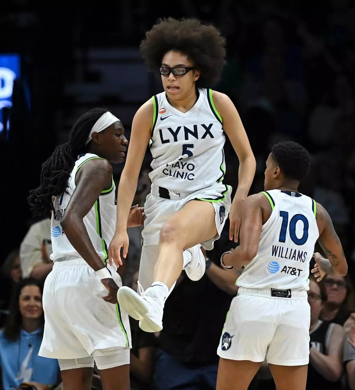 Minnesota Lynx guard Olivia Miles (5) leaps as she's helped off the court after scoring a layup and drawing a foul in the first quarter against the Portland Fire during a WNBA basketball game on Saturday, July 18, 2026, in Minneapolis, Minn. (Aaron Lavinsky/Minnesota Star Tribune via AP)