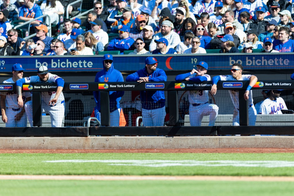 The New York Mets bench reacts during the ninth inning against the Athletics.