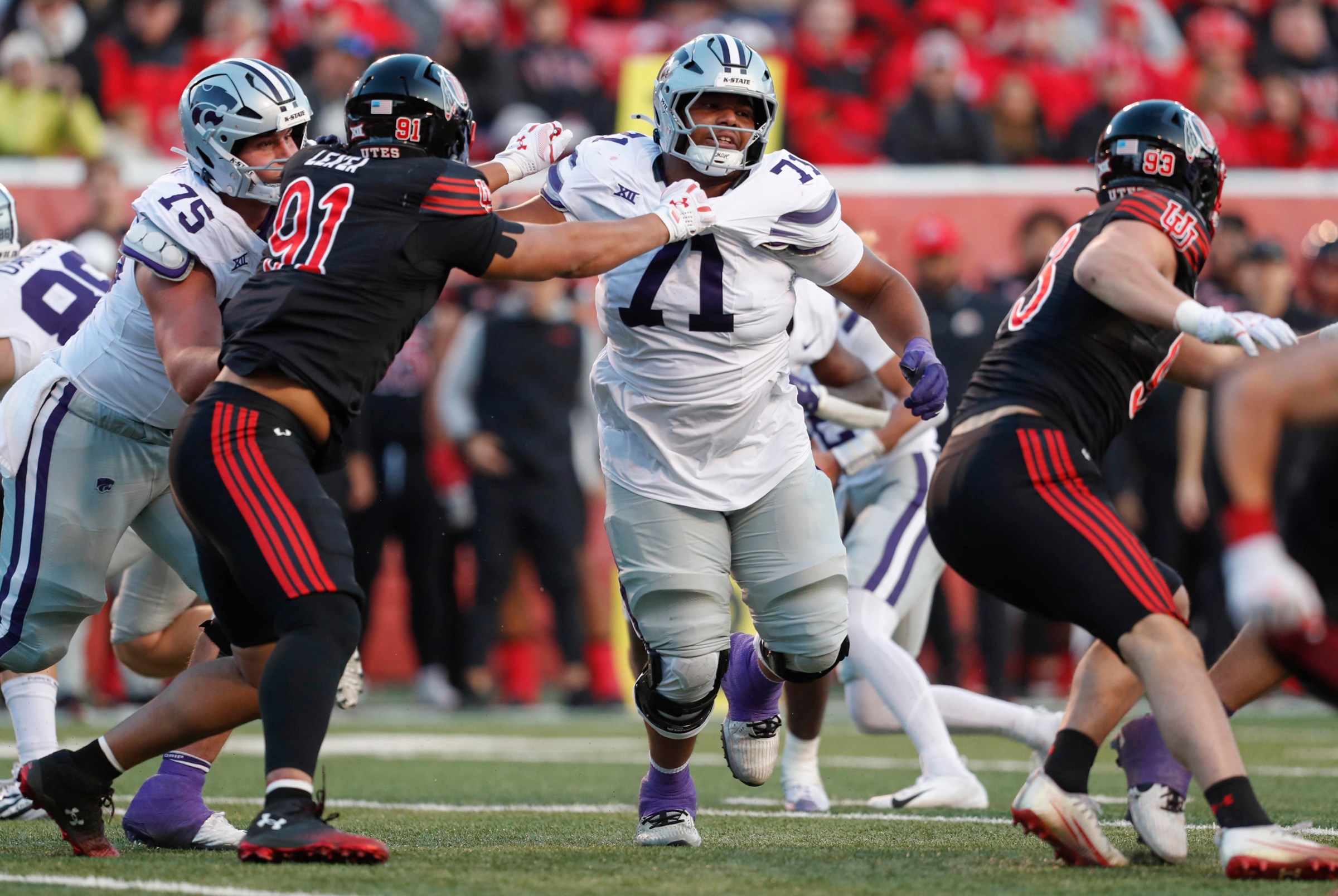 SALT LAKE CITY, UT - NOVEMBER 22: Dylan Villarouel #71 of the Kansas State Wildcats pushes pas Jonah Lea’Ea of the Utah Utes during the second half of their game at Rice-Eccles Stadium on November 22, 2025 in Salt Lake City, Utah. (Photo by Chris Gardner/Getty Images)