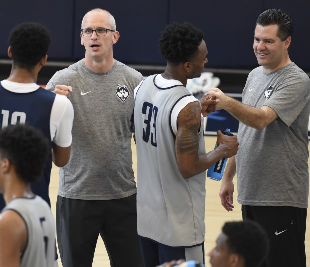 Tom Moore, right, had the chance to be a part of the last two UConn men's titles as an assistant and later GM under head coach Dan Hurley. (Courant file photo.) 