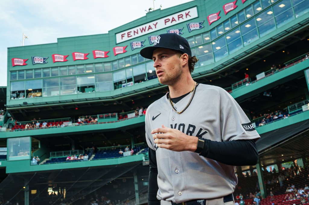 New York Yankees pitcher Cam Schlittler walks to the bullpen at Fenway Park.