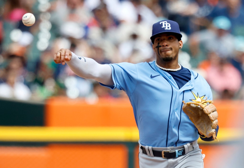 Tampa Bay Rays shortstop Wander Franco throws a baseball.