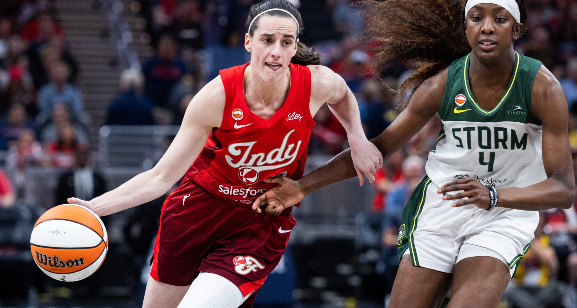 Jul 17, 2026; Indianapolis, Indiana, USA; Indiana Fever guard Caitlin Clark (22) dribbles the ball against Seattle Storm guard Flau'jae Johnson (4) in the second half at Gainbridge Fieldhouse. Mandatory Credit: Trevor Ruszkowski-Imagn Images