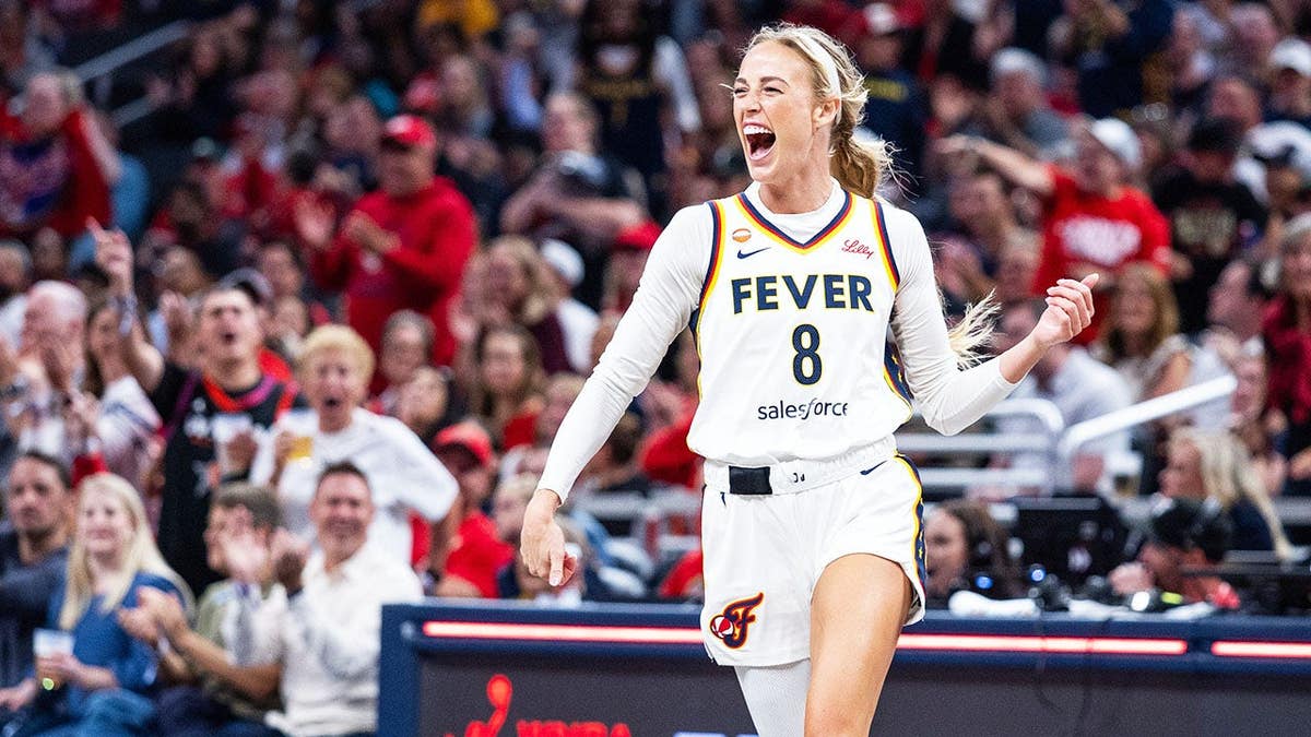 Sophie Cunningham celebrates a blocked shot during an Indiana Fever game against New York Liberty.