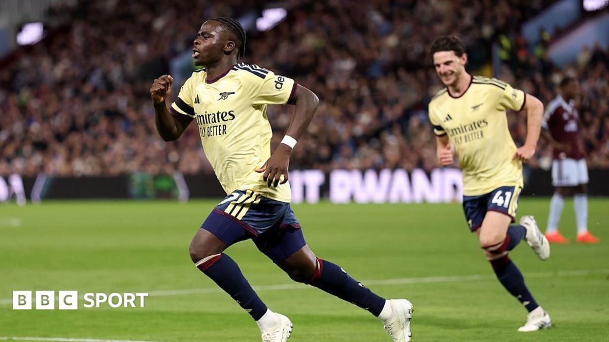 Bukayo Saka runs off in celebration of his goal, followed by Declan Rice