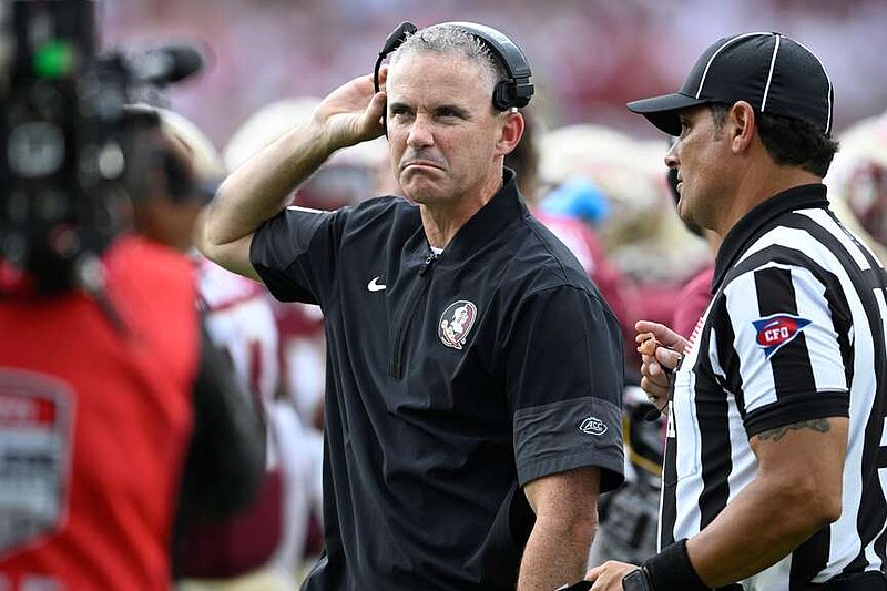 FILE - Florida State head coach Mike Norvell, center, reacts during the first half of an NCAA college football game against Alabama, Saturday, Aug. 30, 2025, in Tallahassee, Fla. (AP Photo/Phelan M. Ebenhack, File)