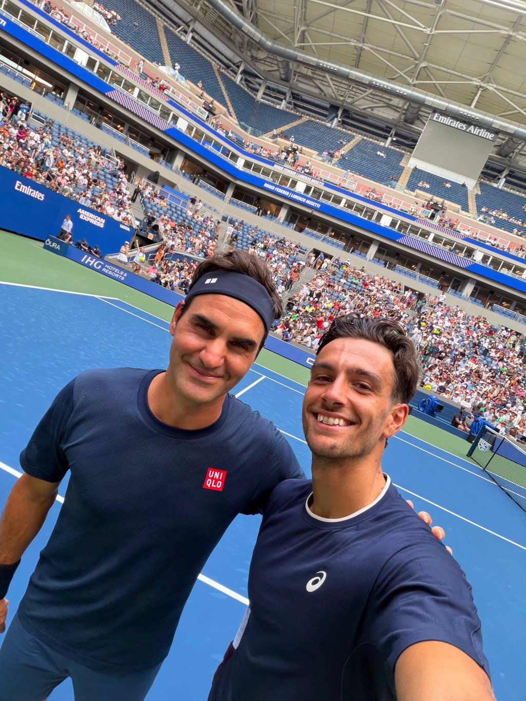 Roger Federer (left) practises alongside Lorenzo Musetti during an exhibition event at the 2026 US Open. Photo: @lore_musetti/Instagram