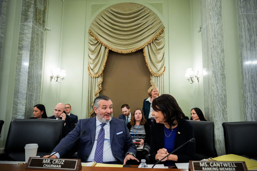 Sen. Ted Cruz, R-Texas, left, chairman of the Senate Commerce, Science and Transportation Committee, speaks with Sen. Maria Cantwell, D-Wash., right, before a hearing Wednesday, Nov. 19, 2025, on Capitol Hill in Washington. (AP Photo/Julia Demaree Nikhinson,File)