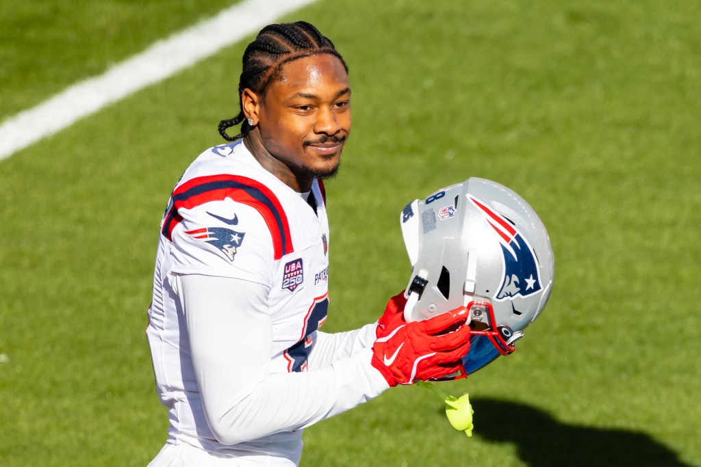 Stefon Diggs (8) of the New England Patriots looks on holding his helmet during the Seattle Seahawks versus the New England Patriots Super Bowl LX game on February 8, 2026, at Levi's Stadium in Santa Clara, CA. 