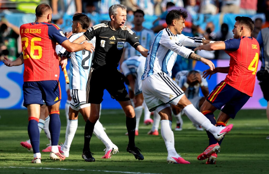Argentina's Leandro Paredes and Spain's Eric Garcia clash at the final whistle during the FIFA World Cup 2026 Final match between Spain and Argentina at New York New Jersey Stadium on July 19, 2026 in East Rutherford, United States.