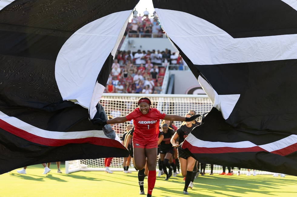 Georgia goalkeeper Jordan Brown (1) leads the team through a banner before the match against...