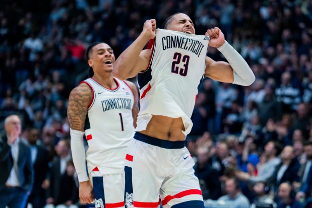 Jayden Ross has been through the highs and lows at UConn and wouldn't have it any other way. Here with Solo Ball.. (Photo by Joe Buglewicz/Getty Images)
