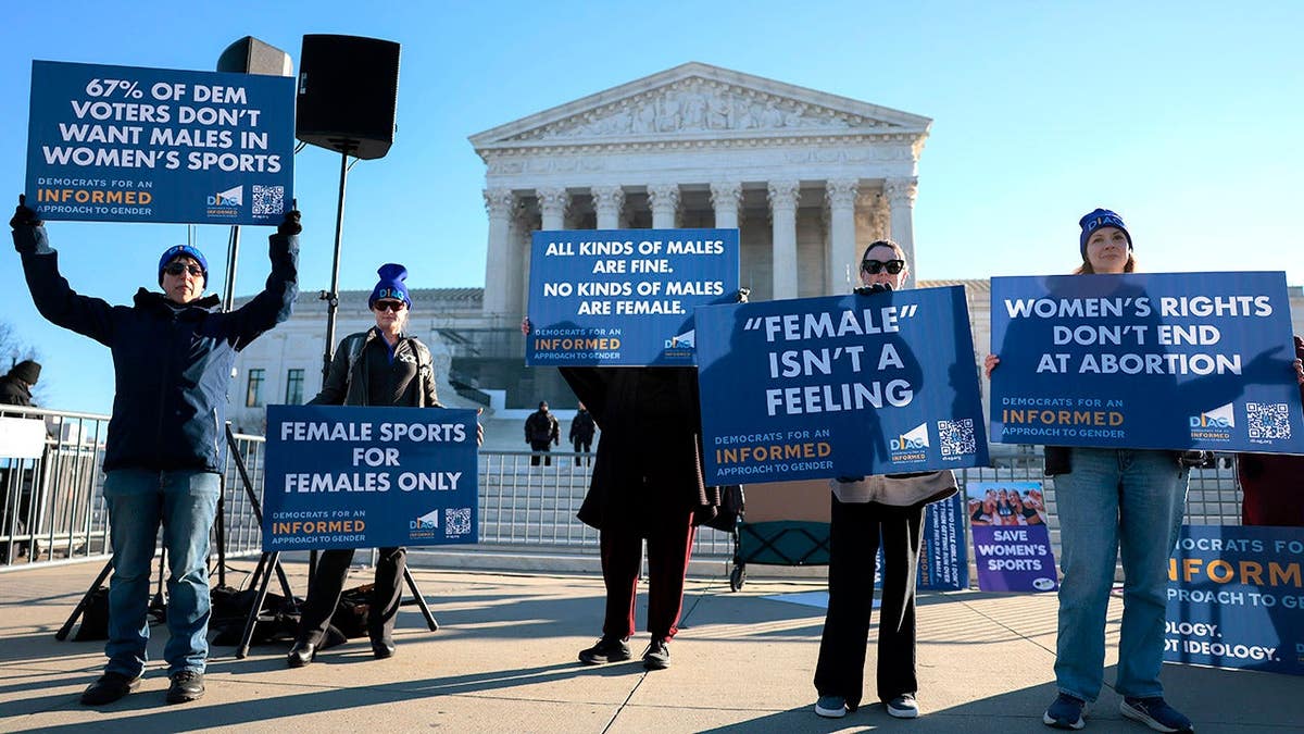 Protesters against transgender athletes competing in women's sports gather outside the Supreme Court in Washington, D.C.