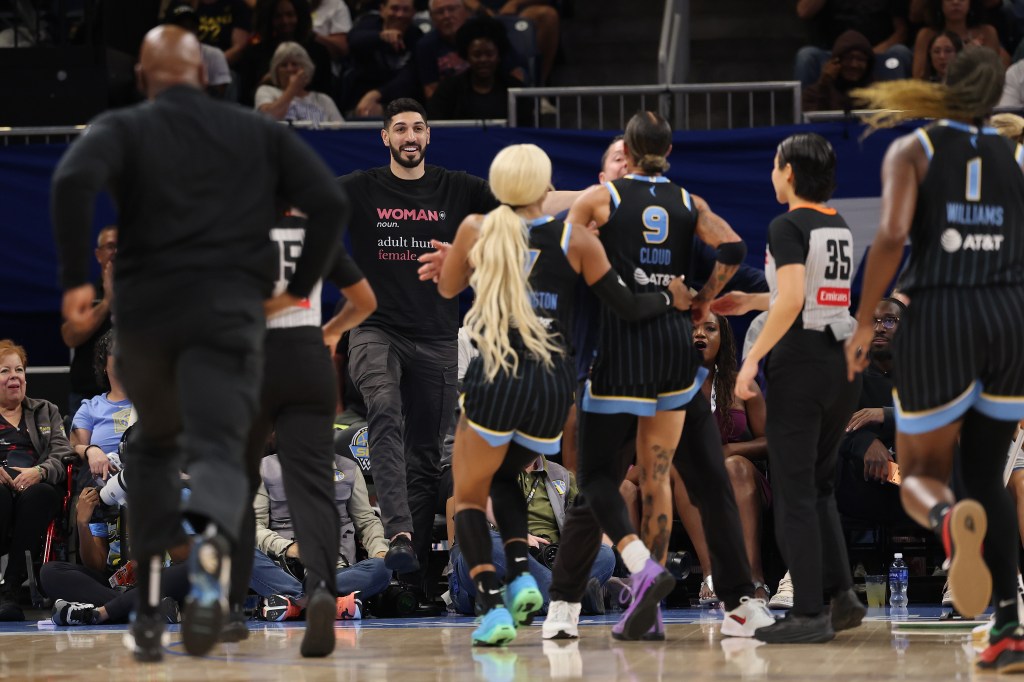 Enes Kanter Freedom, wearing a "Woman noun. adult human female." t-shirt, appears to yell at Chicago Sky player Natasha Cloud.