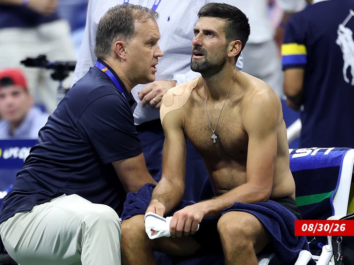 Novak Djokovic of Serbia receives treatment getty