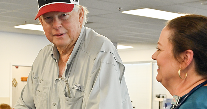 Man with NASCAR ties urges quick action on heart symptoms