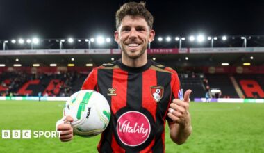 Ryan Christie holds the match ball after his hat-trick for Bournemouth against Lincoln