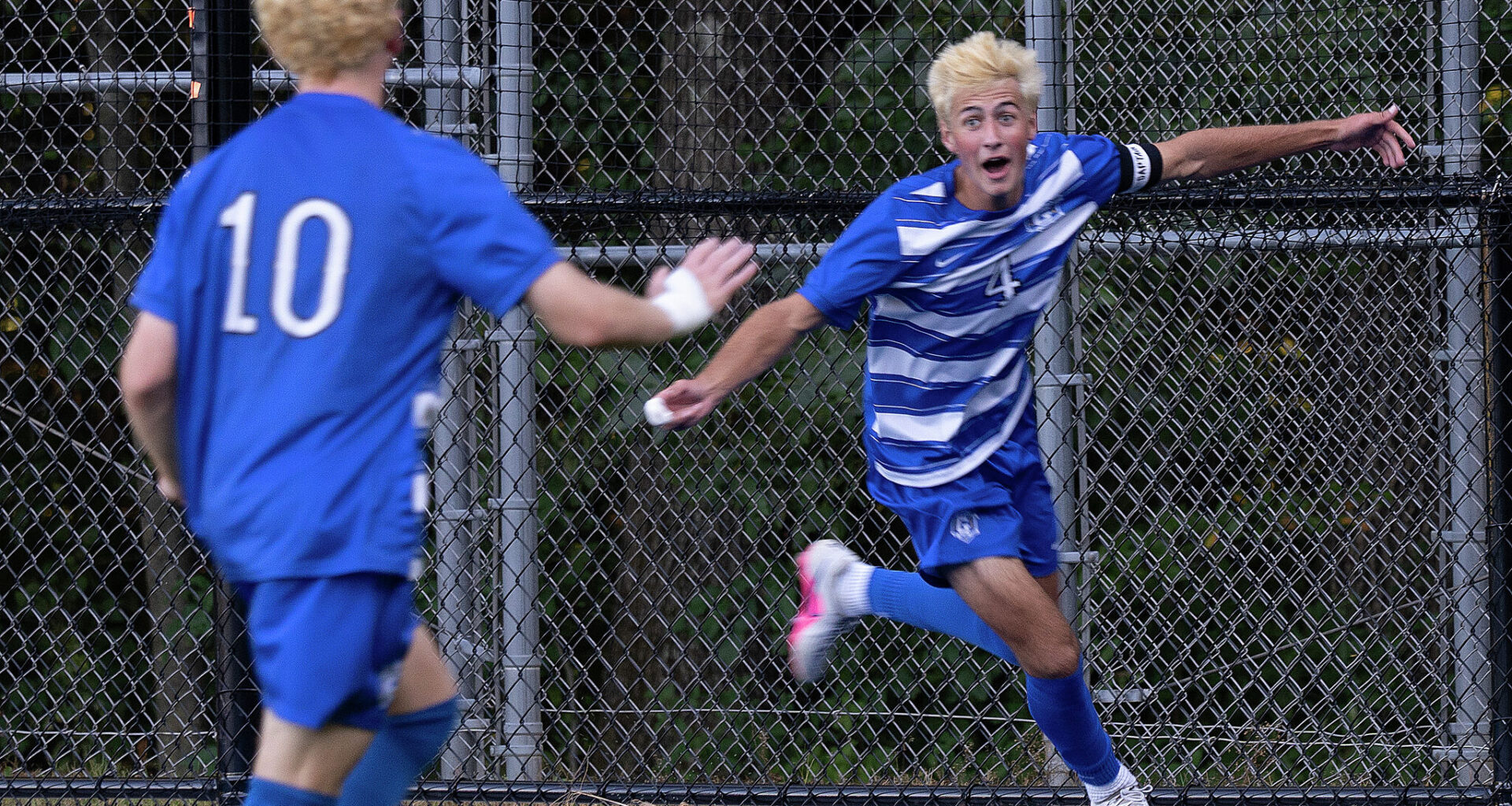 Glastonbury's #4 Brady Nilsen, right, celebrates his go-ahead goal with teammate #10 Jack Smith during the second half of a CIAC high school boys soccer match against Tolland at Glastonbury High School in Glastonbury, Conn., Tuesday, September 15, 2026.