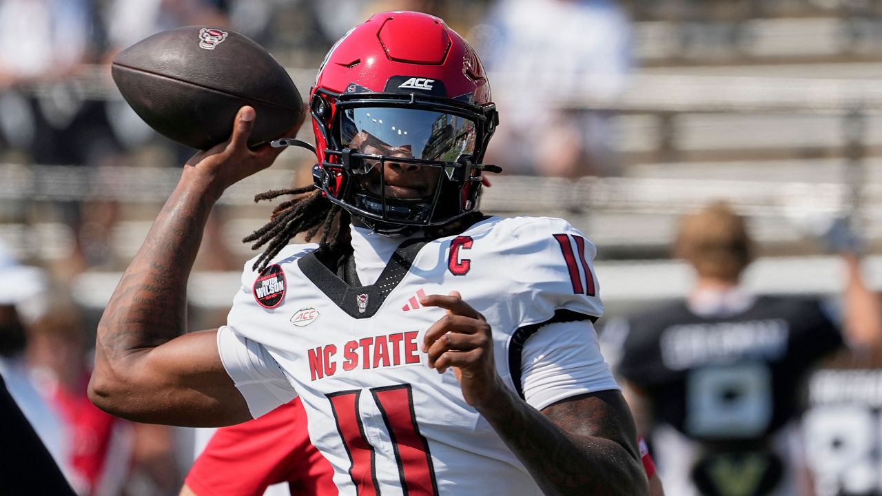 North Carolina State quarterback CJ Bailey (11) warms up before an NCAA college football game against Vanderbilt, Saturday, Sept. 19, 2026, in Nashville, Tenn. (AP Photo/George Walker IV)