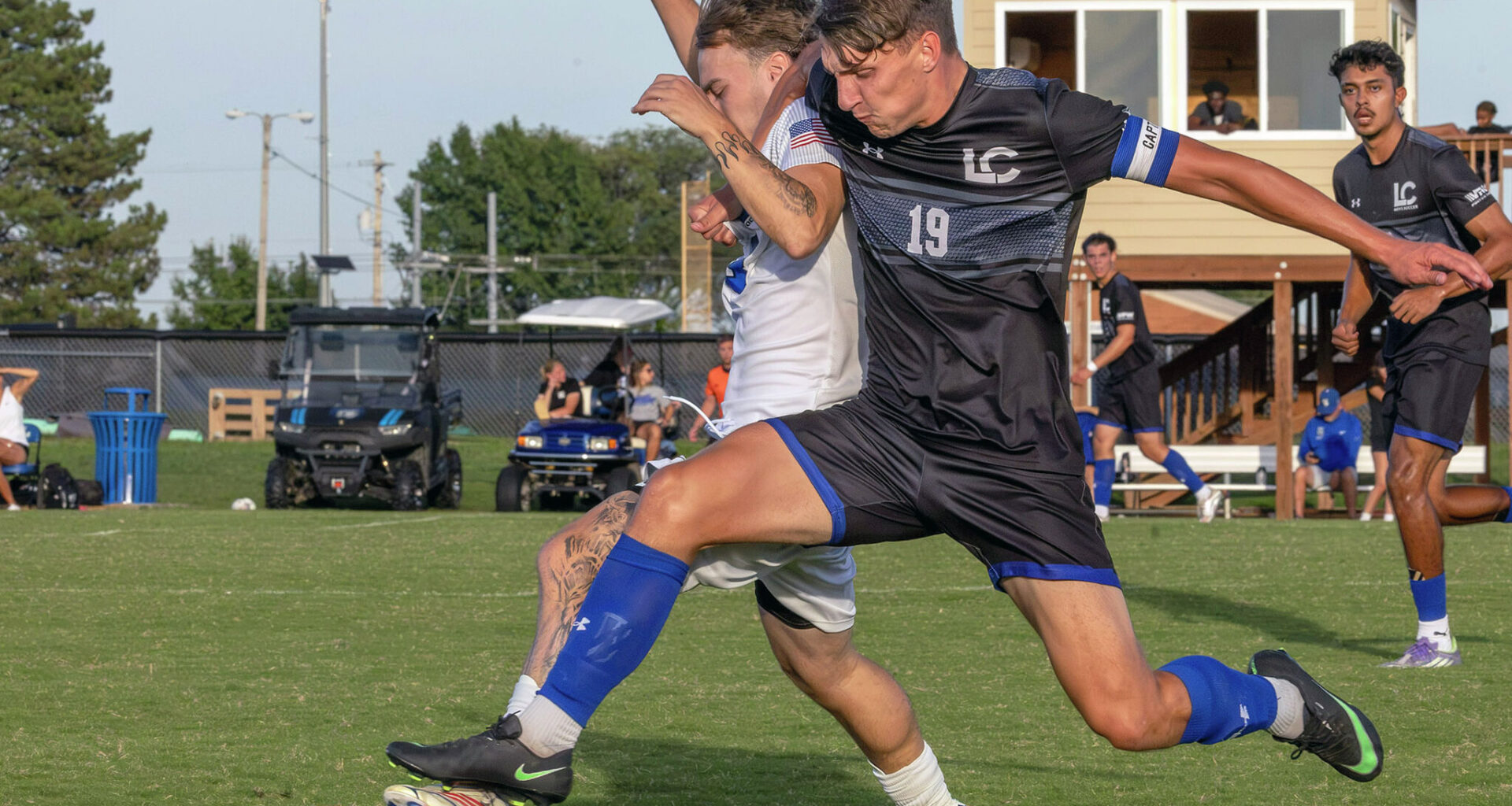 Lewis and Clark's Alex Brownlee (19) battles for the ball with SWIC's Vincent Pratt Tuesday in Belleville. Brownlee scored LC's first goal in their 5-1 victory.