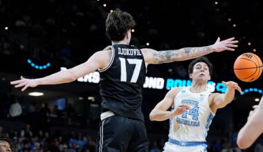 Mar 19, 2026; Greenville, SC, USA; North Carolina Tar Heels guard Luka Bogavac (44) passes the ball around VCU Rams forward Lazar Djokovic (17) in the first half of a first round game of the men's 2026 NCAA Tournament at Bon Secours Wellness Arena. Mandatory Credit: Jim Dedmon-Imagn Images