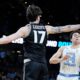 Mar 19, 2026; Greenville, SC, USA; North Carolina Tar Heels guard Luka Bogavac (44) passes the ball around VCU Rams forward Lazar Djokovic (17) in the first half of a first round game of the men's 2026 NCAA Tournament at Bon Secours Wellness Arena. Mandatory Credit: Jim Dedmon-Imagn Images