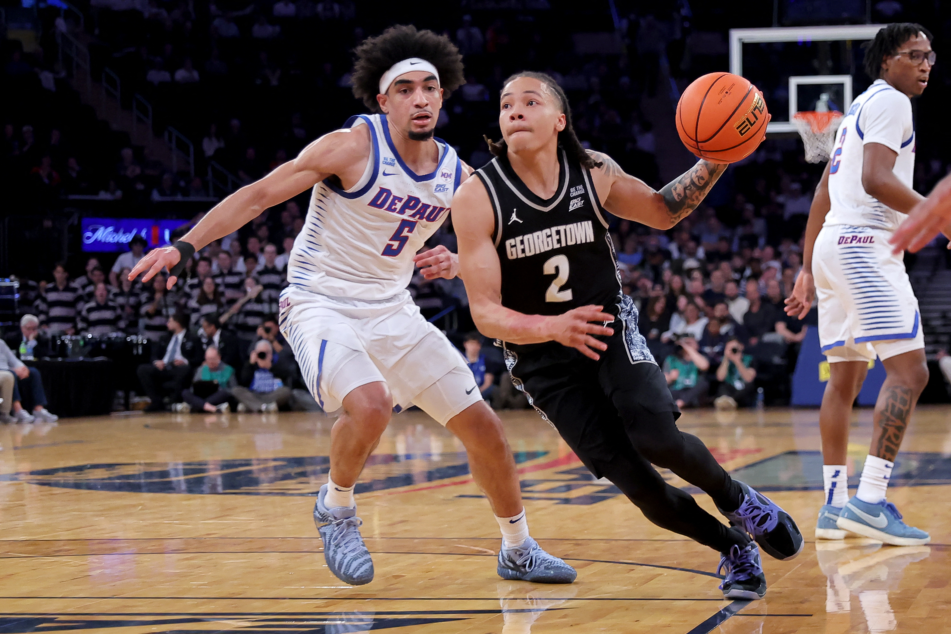 Mar 11, 2026; New York, NY, USA; Georgetown Hoyas guard Malik Mack (2) drives to the basket against DePaul Blue Demons guard RJ Smith (5) during the first half at Madison Square Garden. Mandatory Credit: Brad Penner-Imagn Images