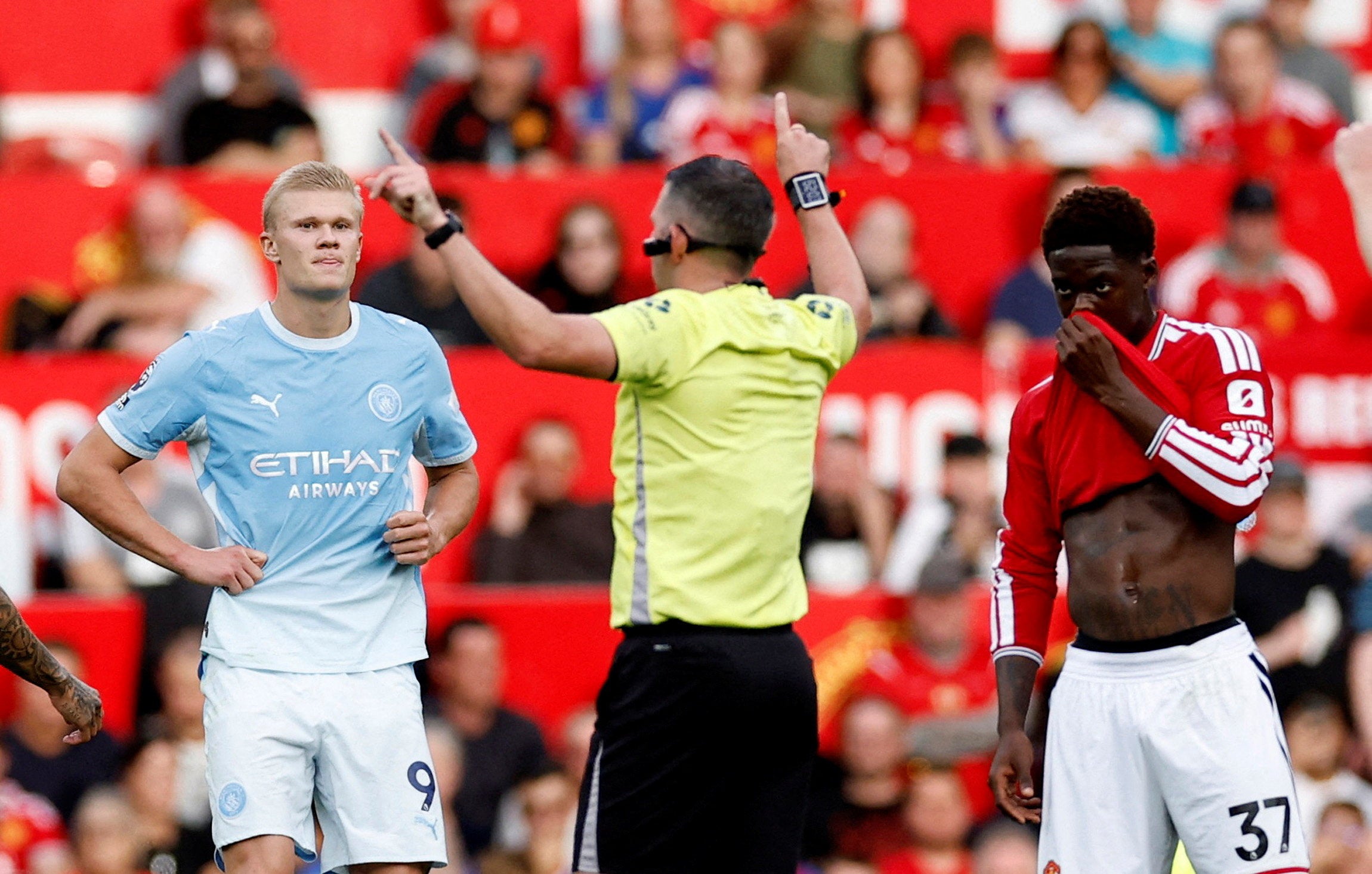 Manchester City's Erling Haaland reacts as referee Michael Oliver awards a goal following a VAR review