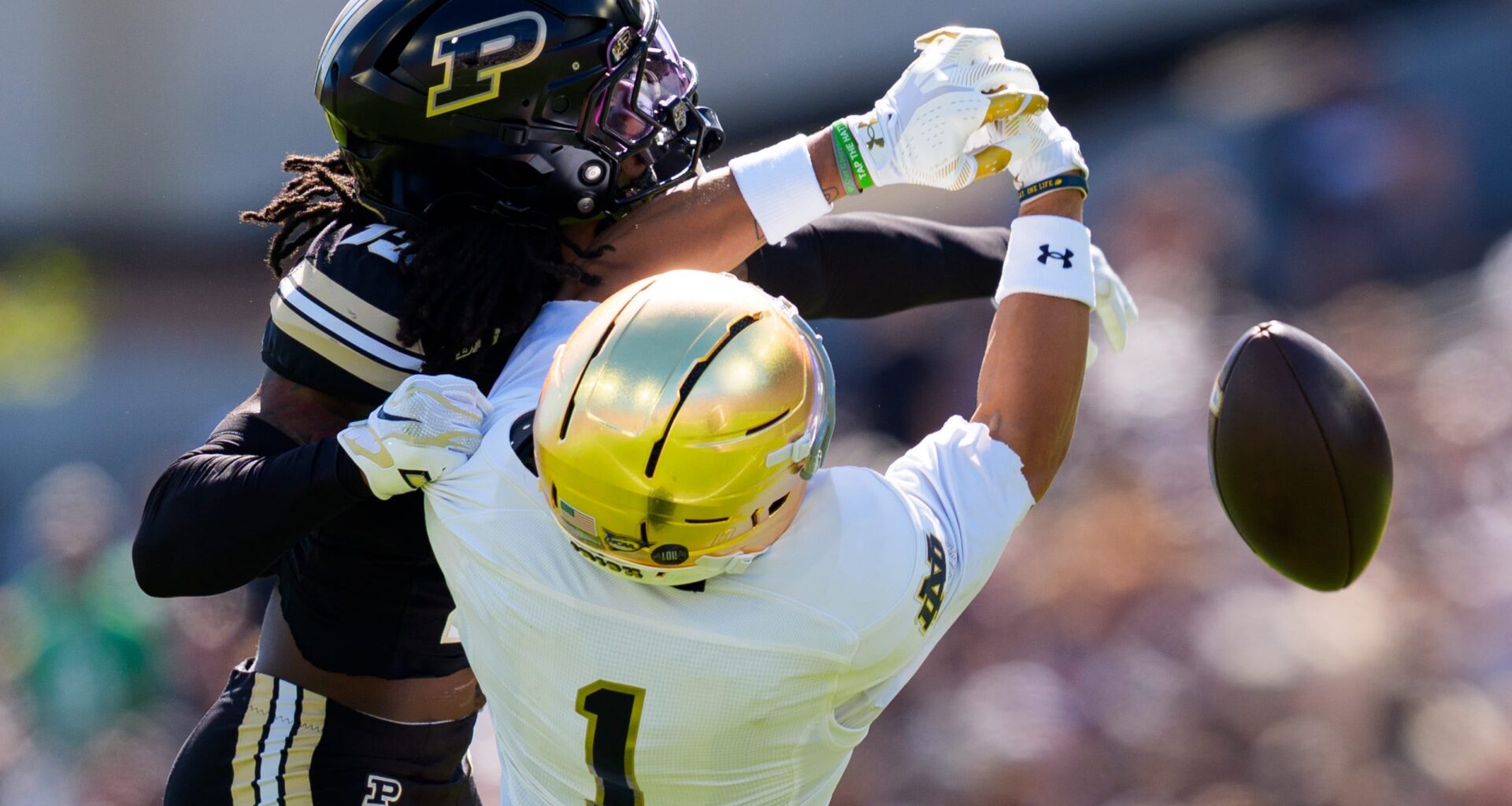 Purdue defensive back John Slaughter, left, interrupts a pass intended for Notre Dame wide receiver Jaden Greathouse (1) during a NCAA football game at Ross-Ade Stadium on Saturday, Sept. 26, 2026, in West Lafayette.