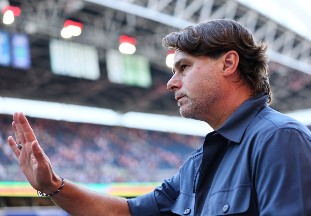 U.S. coach Mauricio Pochettino looks dejected at a soccer match.