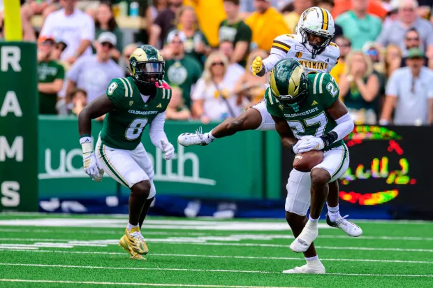 Colorado State linebacker Jaylen King (27) intercepts the ball intended for Wyoming wide receiver Eric Richardson (2) during an NCAA college football game in Fort Collins, Colo., Saturday, Sept. 5, 2026. (AP Photo/Tyler Tate)