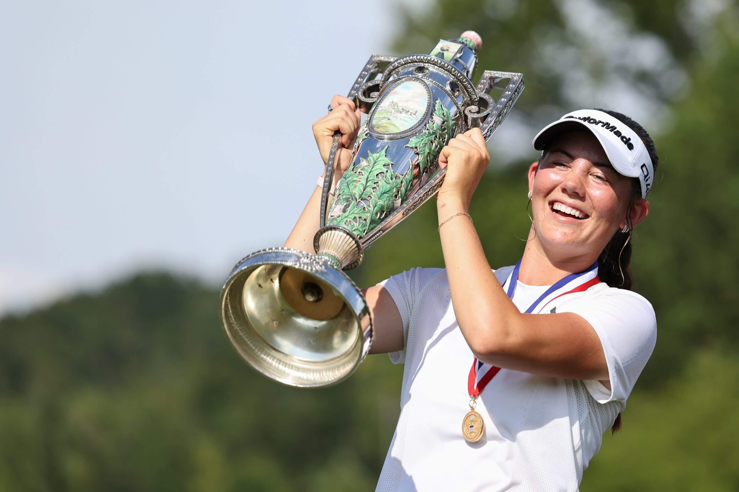 Asterisk Talley holds up the trophy in celebration of winning the U.S. Women's Amateur last month.