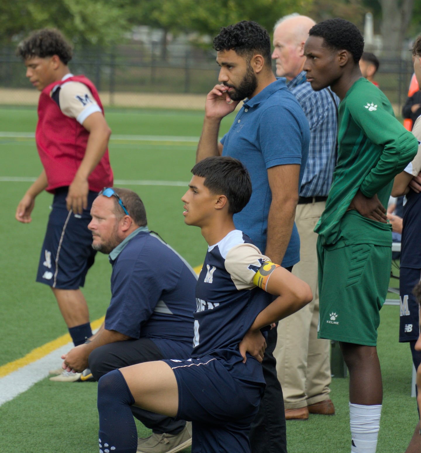 Coach Jeremiah Smith (left), with senior co-captain Juan Caballero Valencia (front) alongside, is in his 22nd season at Malden.
