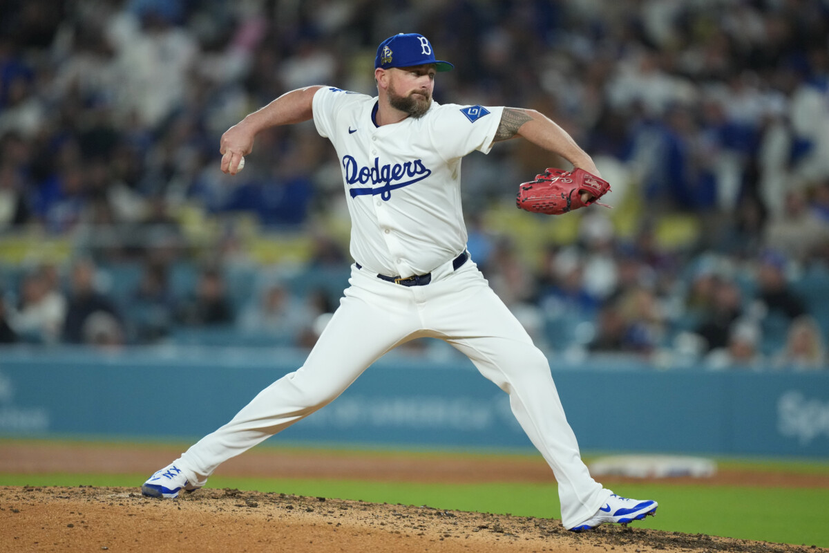 Apr 15, 2025; Los Angeles, California, USA; Los Angeles Dodgers pitcher Kirby Yates (38) replaces Jack Dreyer (86) in the top of the seventh inning against the Colorado Rockies at Dodger Stadium. Mandatory Credit: Kirby Lee-Imagn Images