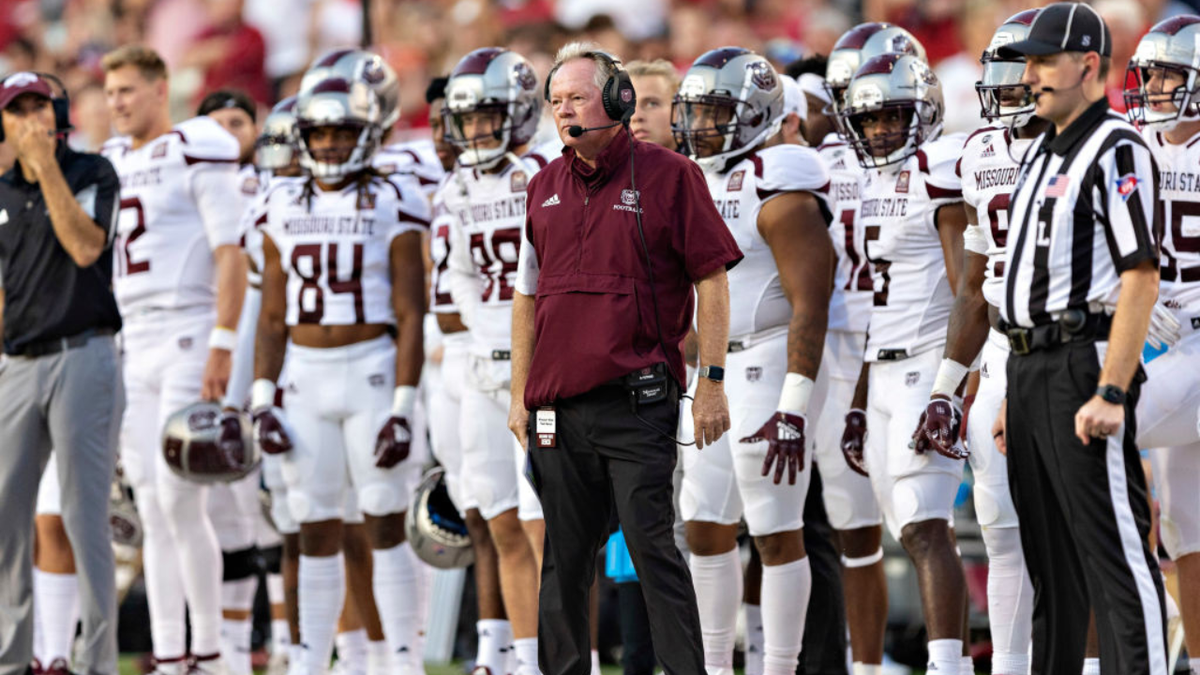 Bobby Petrino stands on the sidelines during a football game in Fayetteville, Arkansas.