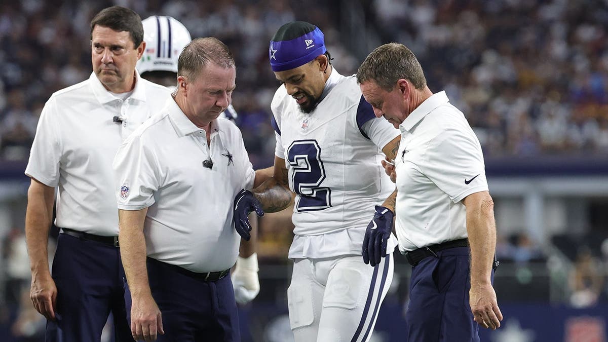 Cobie Durant walks off the field with an apparent injury during an NFL game.